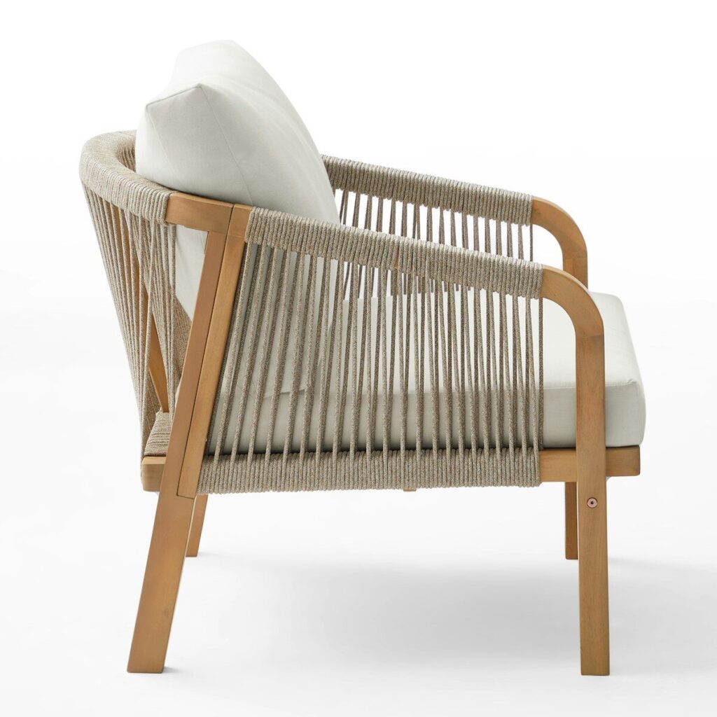 A modern armchair with a wooden frame and rope detailing.