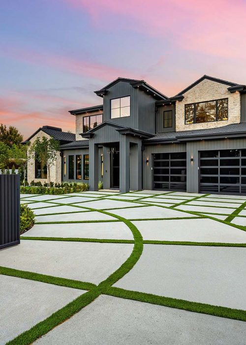 modern-house-with-designed-driveway-at-sunset-WG6U2AR.jpg